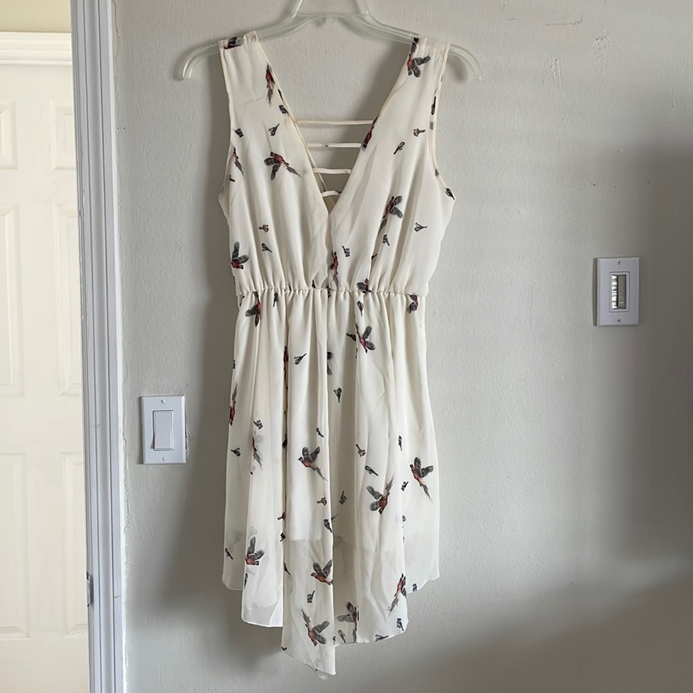 Asymmetrical dress, spaghetti’s traps and birds design
